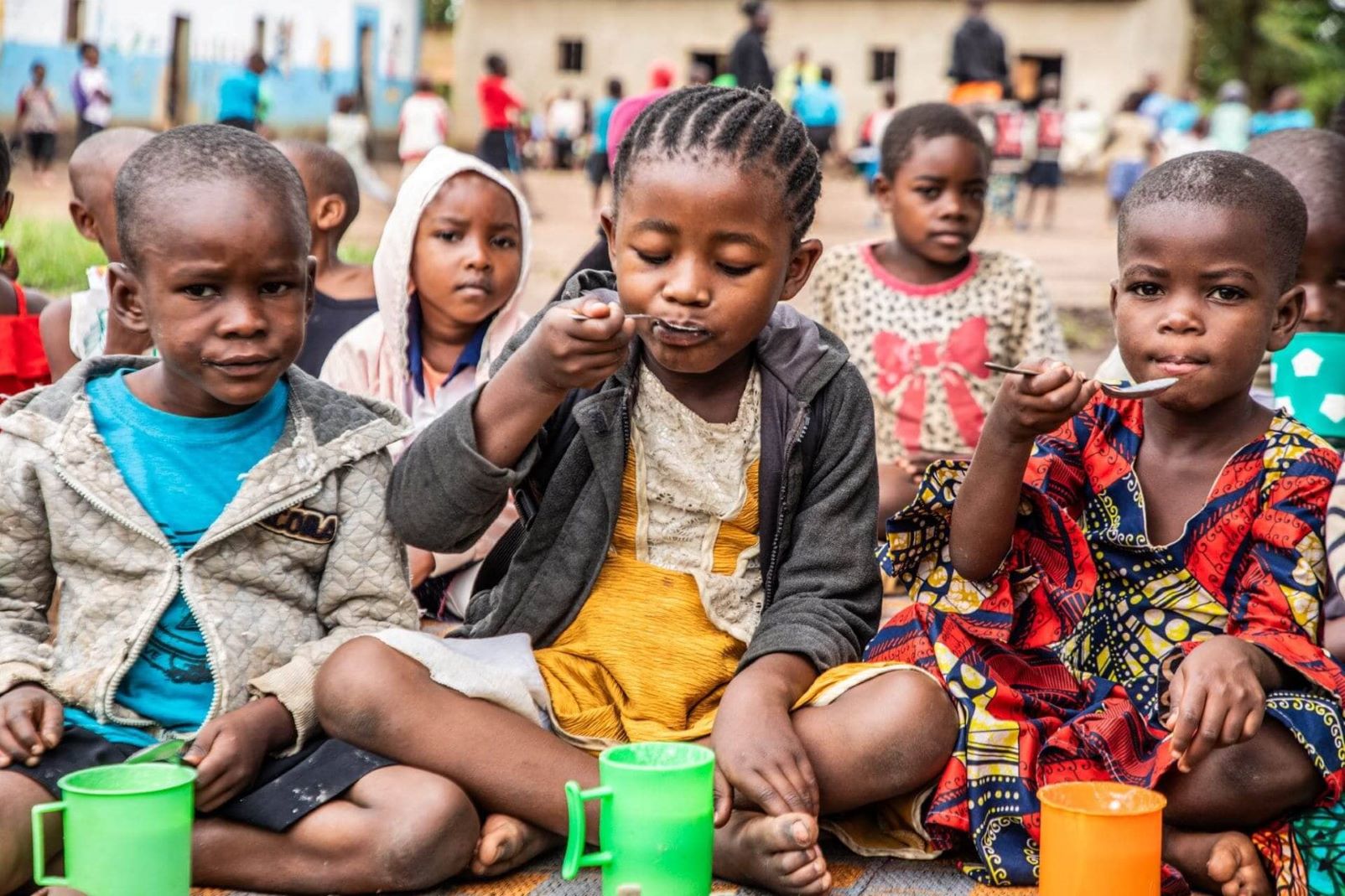 Porridge break at PIVOT ECD Center, Kyaka II - Kulea Watoto supported the ECD center with setting up a demonstration garden and a cash grant that has enabled it to introduce a school feeding programme. © IRC/Jonathan Ssekitondo