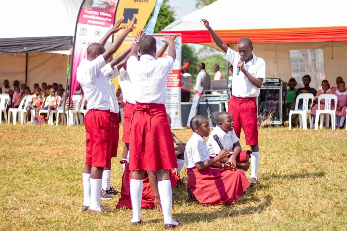 Learners from St Pios Primary School perform a powerful skit during the Day of the African Child celebrations in Kamwenge - Kulea Watoto