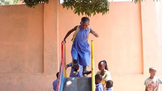 Children playing under the watch of a caregiver at a play-space supported by the Kulea Watoto Project in Konge, Makindye Division
