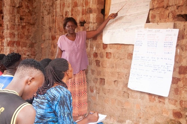 Scovia Kyalisima and colleagues attending the English language session in Nsambya, Makindye division